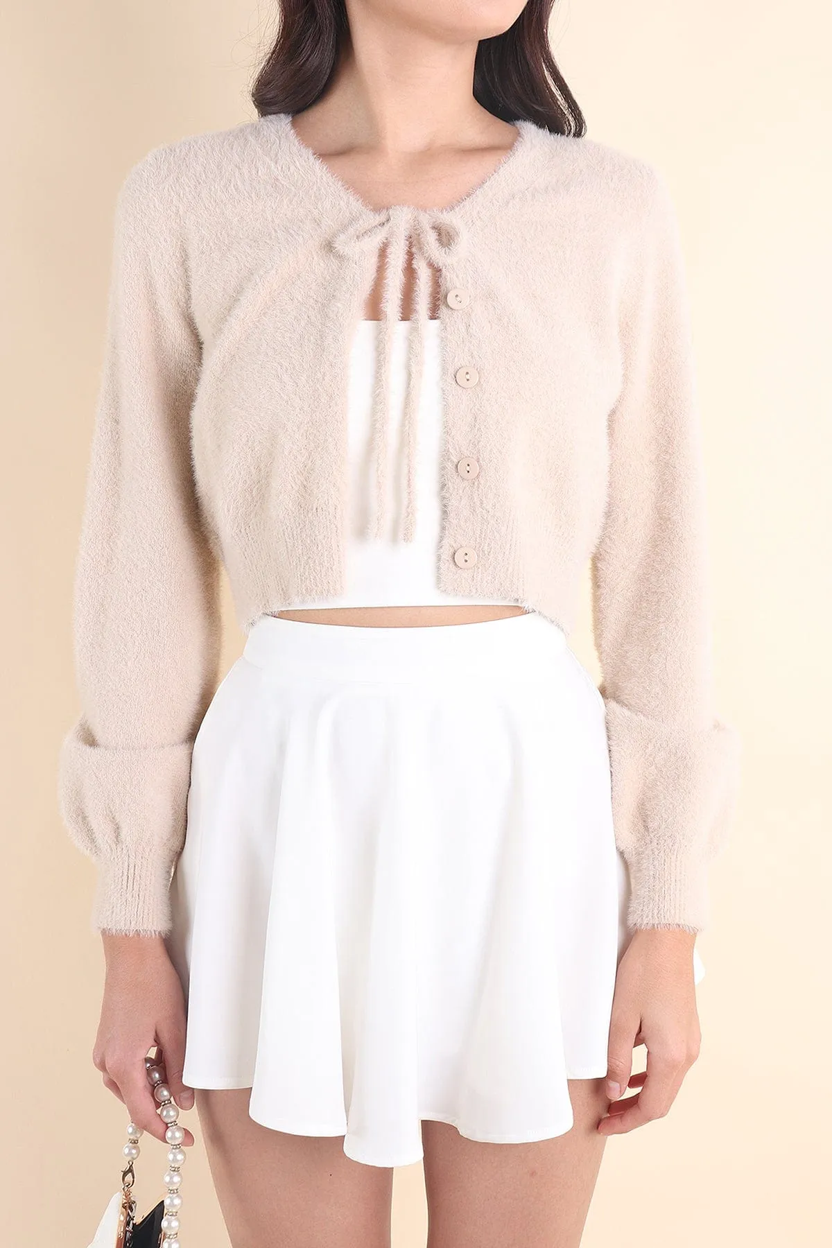 ELIZ BOW FURRY CARDIGAN IN ALMOND